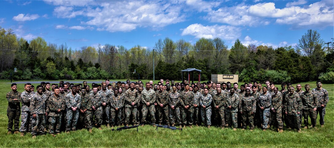 U.S. Marines with Headquarters Battalion pose for a picture during a Battalion meet/ Mess Night in vicinity of Camp Upshur at Marine Corps Base Quantico, Virginia, April 18, 2024. Like so many of our service traditions, the term "Mess Night" and the format used in the U.S. Navy today was derived from the British Navy to honor custom and tradition as a means of respecting the past. (U.S. Marine Corps photo by Cpl. Christopher Zincke)