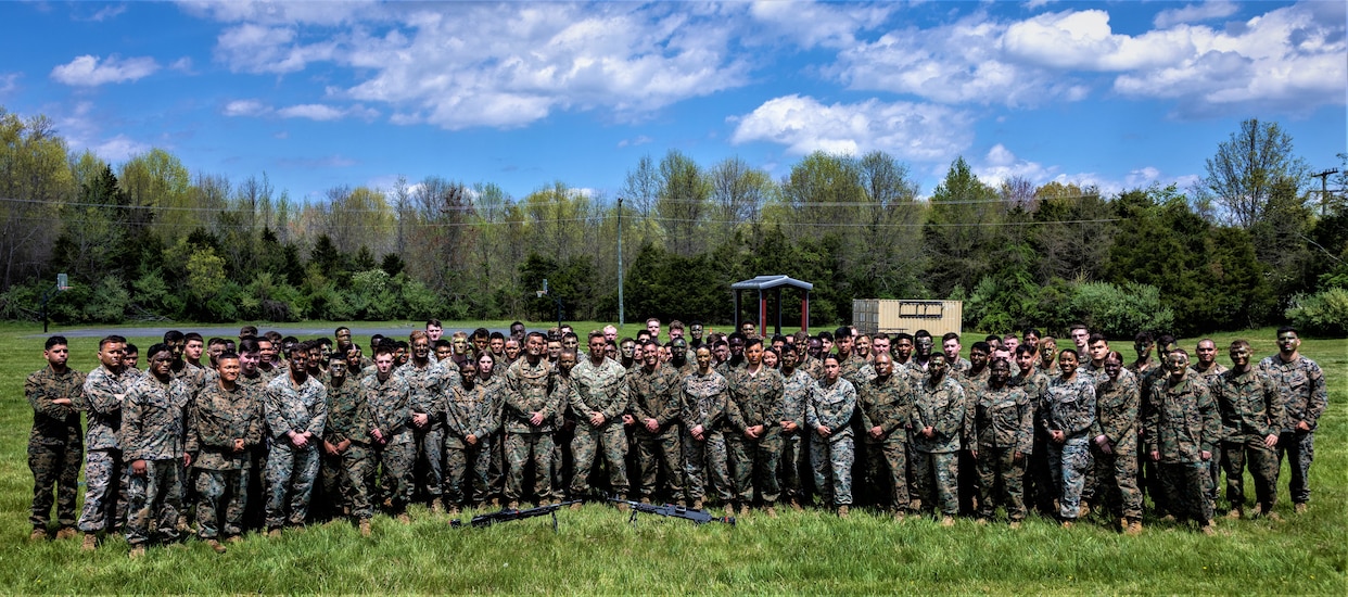 U.S. Marines with Headquarters Battalion pose for a picture during a Battalion meet/ Mess Night in vicinity of Camp Upshur at Marine Corps Base Quantico, Virginia, April 18, 2024. Like so many of our service traditions, the term &quot;Mess Night&quot; and the format used in the U.S. Navy today was derived from the British Navy to honor custom and tradition as a means of respecting the past. (U.S. Marine Corps photo by Cpl. Christopher Zincke)
