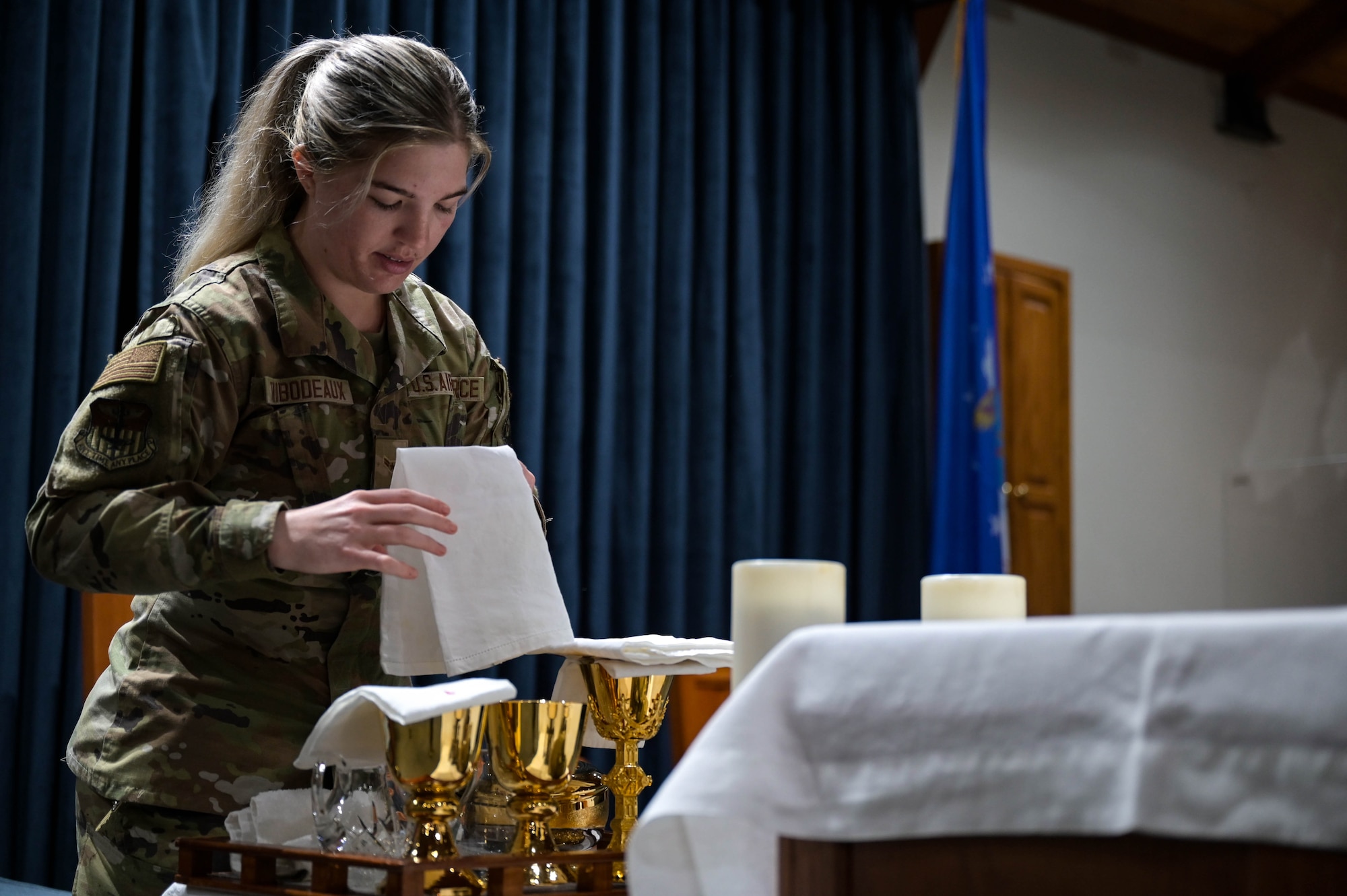 U.S. Air Force Airman 1st Class Blakeley Thibodeaux, a 1st Special Operations Wing religious affairs Airman, prepares communion in the Chapel at Hurlburt Field, Florida, April 16, 2024.