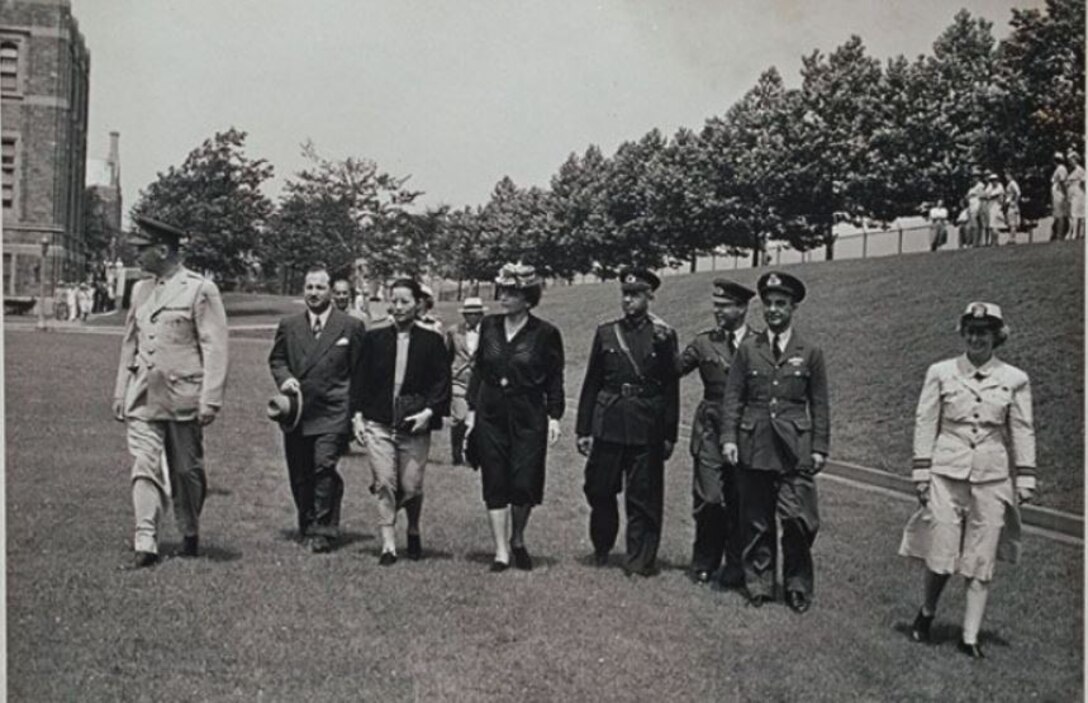 Lieutenant Commander Elizabeth Reynard (far right) leads a group of United Nations delegates including Virginia Gildersleeve (fourth from left) across the lawn of the U.S. Naval Training School (WR) in the Bronx during a military review of the WAVES, ca. 1945. Gildersleeve was the only woman selected for the U.S. delegation that drafted and signed the United Nations charter at the San Francisco Conference in 1945. (U.S. Navy photo from the Schlesinger Library, Harvard Radcliffe Institute)