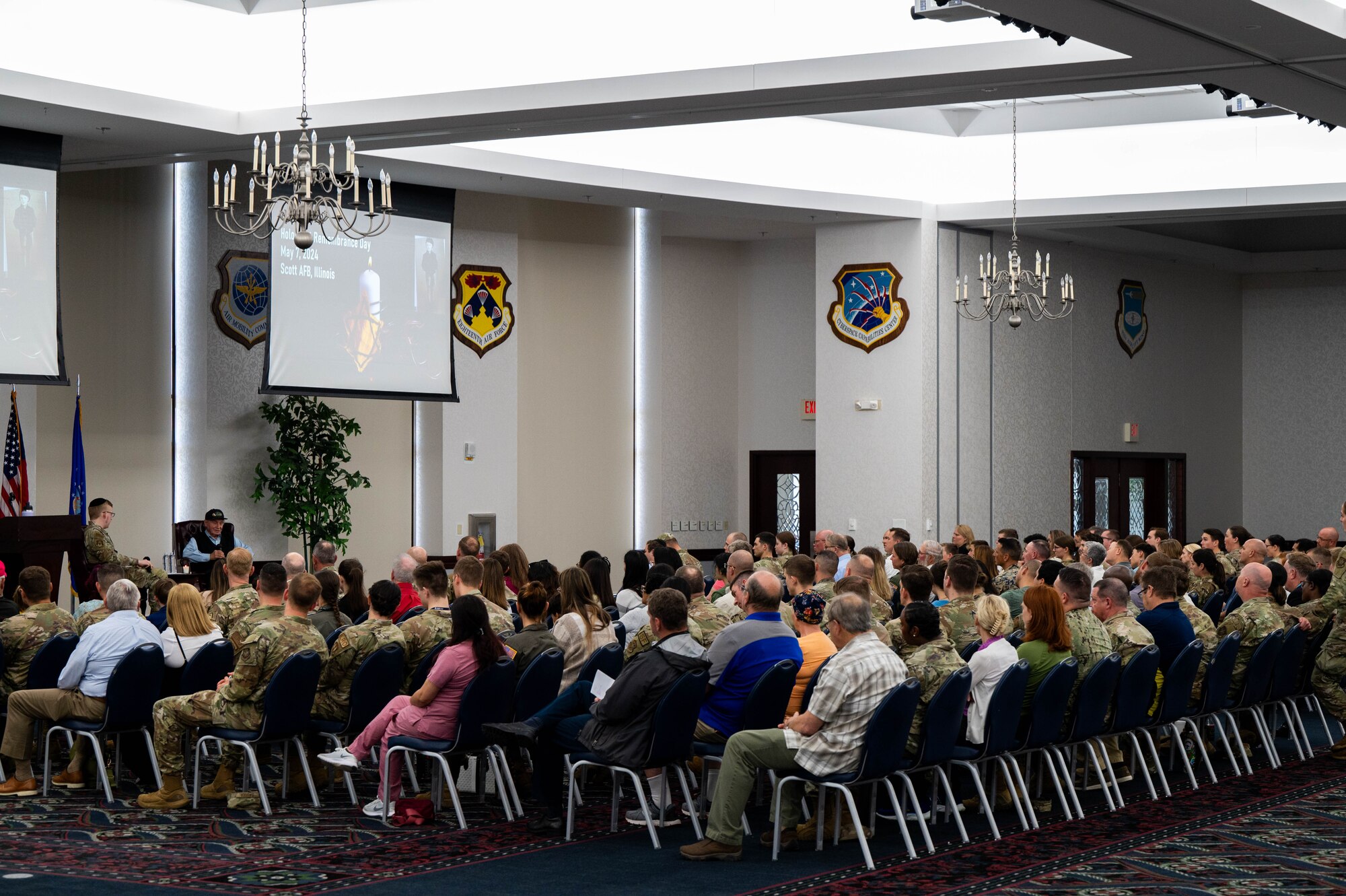 Airmen listen to Holocaust Survivor.