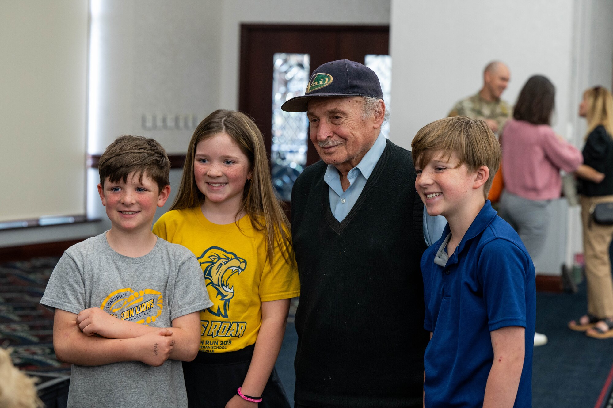 Children pose with Holocaust Survivor.