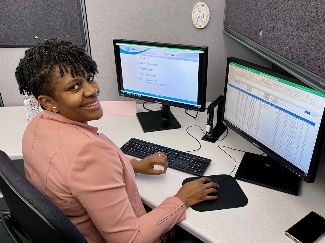 a women sits in front of her computer