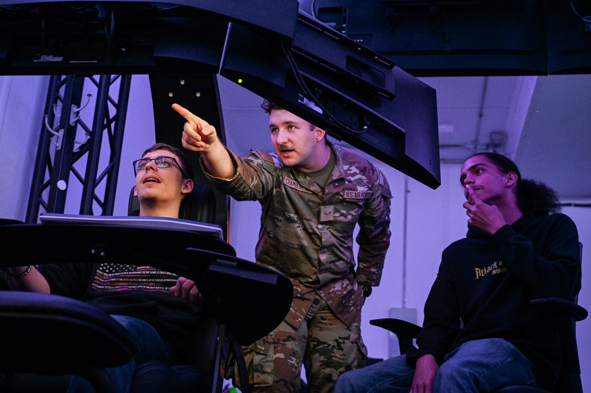 U.S. Air Force Airman 1st Class Christopher Chamberlain, 97th Communications Squadron cyber security technician, shows students from Altus High School’s robotics team, a cyber security program at Altus Air Force Base, Oklahoma, May 2, 2024. The program was a scenario where a company had been hacked and the students attempted to save the files. (U.S. Air Force photo by Airman 1st Class Jonah G. Bliss)