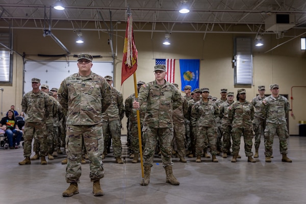 Oklahoma Army National Guard members of the 1245th Transportation Company, 345th Combat Sustainment Support Battalion, 90th Troop Command, stand in formation at their Meritorious Unit Commendation ceremony at the Ada Readiness Center in Ada, Oklahoma, May 4, 2024. The unit was awarded the commendation in recognition of their accomplishments during their 2018-2019 deployment to Kuwait in support of Operation Spartan Shield and Operation Inherent Resolve. (Oklahoma National Guard photo by Cpl. Danielle Rayon)