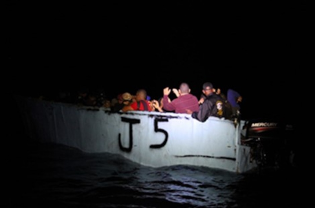 Coast Guard Cutter Joseph Tezanos interdicts a migrant makeshift vessel May 4, 2024, southwest of Mona Island, Puerto Rico. Coast Guard Cutter Joseph Tezanos repatriated 51 migrants from this voyage to a Dominican Republic Navy vessel off Punta Cana, Dominican Republic, May 4, 2024. (U.S. Coast Guard photo)