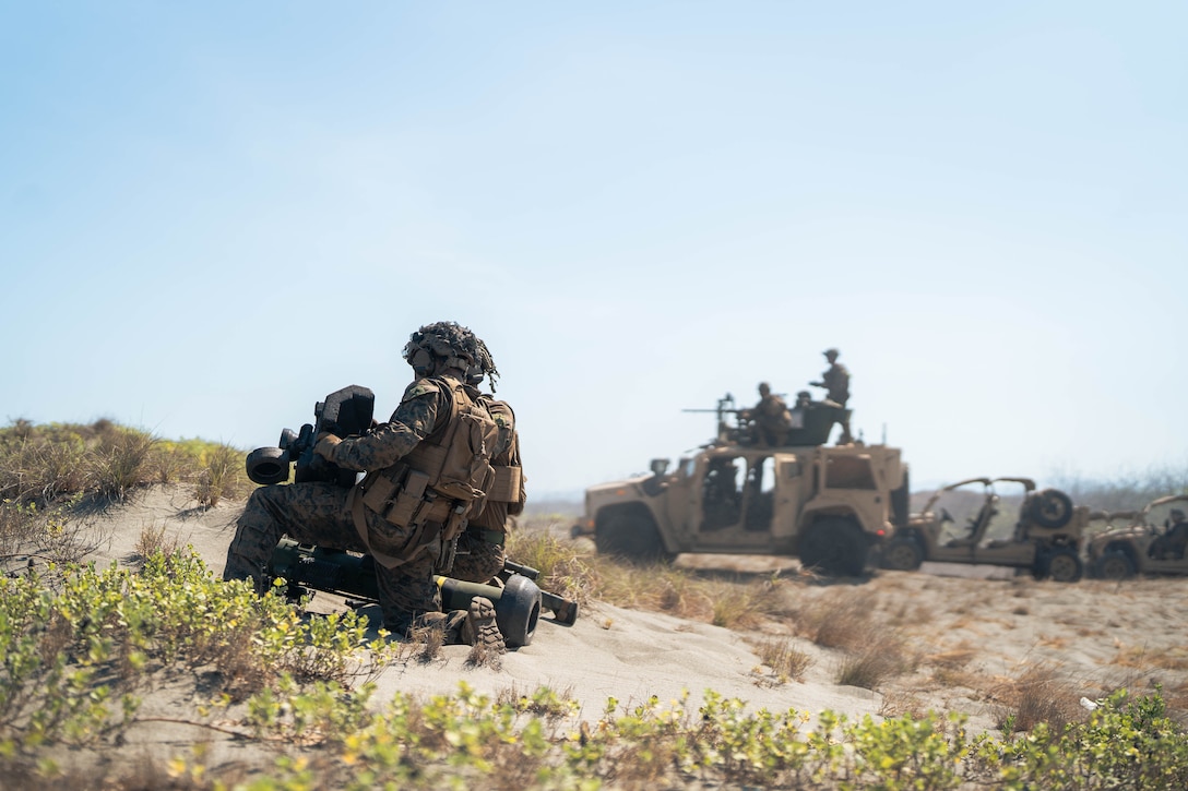 U.S. Marines with 3rd Littoral Combat Team, 3rd Marine Littoral Regiment, 3rd Marine Division, load a Javelin shoulder-fired anti-tank missile as part of a counter landing live-fire exercise during Balikatan 24 at La Paz Sand Dunes, Ilocos Norte, Philippines, May 6, 2024. BK24 is an annual exercise between the Armed Forces of the Philippines and the U.S. military designed to strengthen bilateral interoperability, capabilities, trust, and cooperation built over decades of shared experiences. (U.S. Marine Corps photo by Cpl. Eric Huynh)