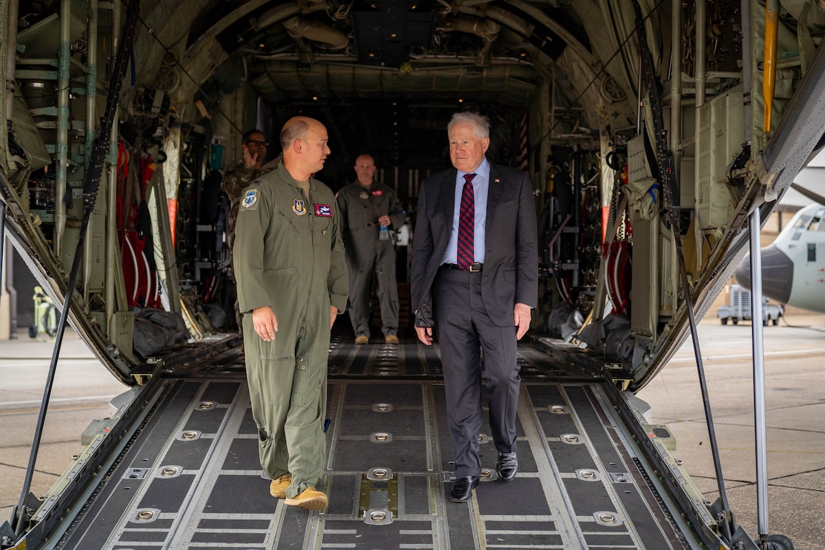 Secretary of the Air Force Frank Kendall exits a C-130J with U.S. Air Force Col. John Benson, 403rd Wing commander, at Keesler Air Force Base, Mississippi, May 3, 2024.