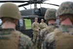 Indiana National Guard Sgt. 1st Class Throne Martin, a 38th Combat Aviation Brigade crew chief from Shelbyville, Indiana, briefs Marines during medevac training in Lawrence, Indiana, May 4, 2024.