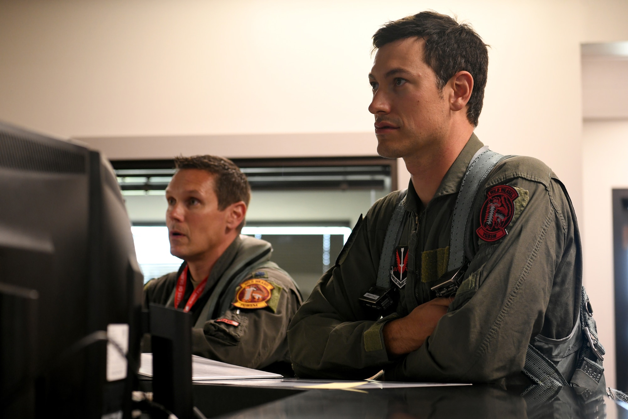 U.S. Air Force Lt. Col. Daniel Trueblood, 77th Fighter Squadron commander, left, and NASCAR driver Joey Logano, attend a pre-flight briefing prior to their flight in an F-16 Fighting Falcon at Shaw Air Force Base, S.C., May 7, 2024. The pre-flight briefing covered weather conditions, airspace information and all other pertinent information prior to takeoff. (U.S. Air Force photo by Staff Sgt. Kelsey Owen)
