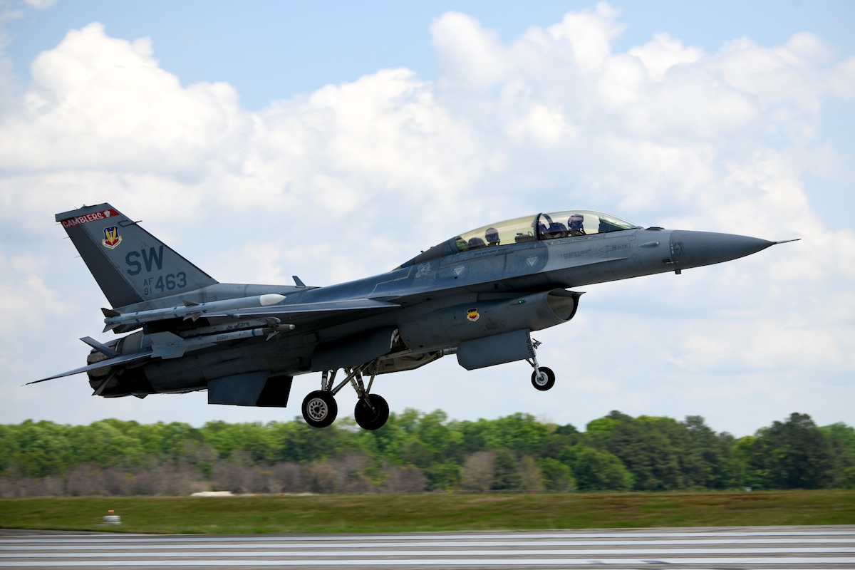 U.S. Air Force Lt. Col. Daniel Trueblood, 77th Fighter Squadron commander, and NASCAR driver Joey Logano touch down after a flight in an F-16 Fighting Falcon at Shaw Air Force Base, S.C., May 7, 2024. Logano visited Shaw AFB to meet the men and women serving in the U.S. Armed Forces, as well as learn about the mission of the 20th Fighter Wing and fly in an F-16. (U.S. Air Force photo by Staff Sgt. Kelsey Owen)