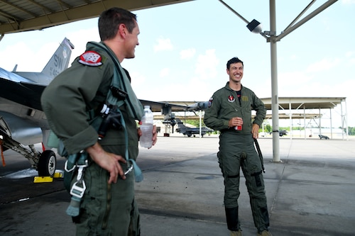 NASCAR driver Joey Logano, right, talks about his experience after flying in an F-16 Fighting Falcon with U.S. Air Force Lt. Col. Daniel Trueblood, 77th Fighter Squadron commander, at Shaw Air Force Base, S.C., May 7, 2024. The U.S. Air Force aims to recruit and develop a diverse force with the skills and creativity to deliver winning airpower any time, any place. (U.S. Air Force photo by Staff Sgt. Kelsey Owen)