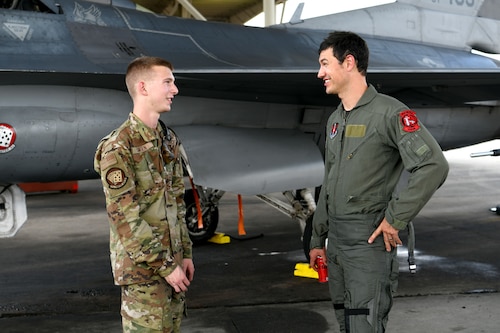 NASCAR driver Joey Logano, right, speaks with Airman 1st Class Dallas Hansen, 77th Fighter Generation Squadron crew chief, who was in charge of the F-16 Fighting Falcon Logano flew in at Shaw Air Force Base, S.C., May 7, 2024. Shaw AFB is dedicated to maintaining a culture and environment of excellence in which everyone can reach their full potential. (U.S. Air Force photo by Staff Sgt. Kelsey Owen)