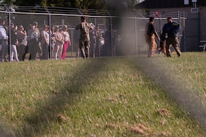 Medical Group Community Providers watch a Military Working Dog bite demonstration during the 436th Medical Group Community Providers Meet and Greet on Dover Air Force Base, Delaware, May 2, 2024. This event aided in Team Dover’s commitment to building partnerships in the surrounding community. (U.S. Air Force Photo by Airman 1st Class Dieondiere Jefferies)