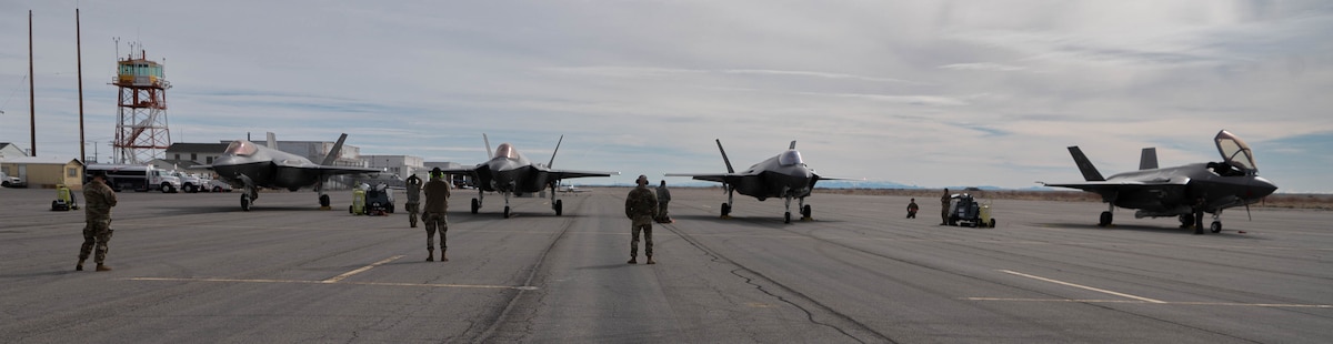 F-35A Lightning IIs wait on the ramp to be refueled at historic Wendover Airfield, Utah, March 27, 2024. Airmen from the 34th Fighter Squadron and Fighter Generation Squadron tested their F-35 agile combat employment and readiness capabilities during an exercise in Utah, Nevada and Idaho.