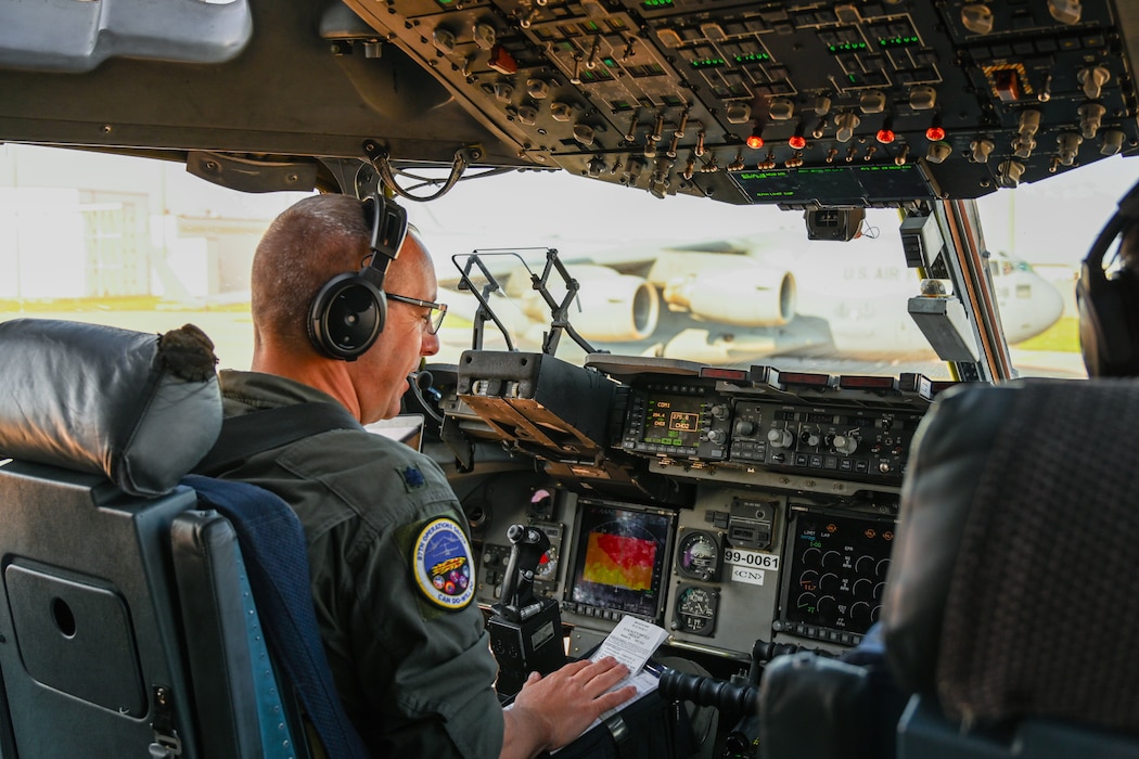 U.S. Air Force Lt. Col. Andrew J. Stewart, 97th Operations Group deputy commander, conducts pre-flight checks in a C-17 Globemaster III aircraft at Altus Air Force Base, Oklahoma, April 30, 2024. The C-17’s maximum payload capacity is 170,900 pounds and its maximum gross takeoff weight is 585,000 pounds. (U.S. Air Force photo by Airman 1st Class Jonah G. Bliss)
