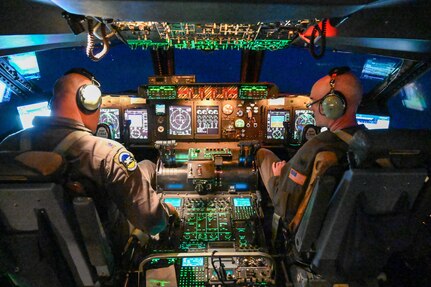 Col. William Gutermuth, right, 433rd Airlift Wing commander, and Lt. Col. Christopher Jones, left, 356th Airlift Squadron commander prepare a 433rd AW C-5M Super Galaxy for takeoff at Dover Air Force Base, Delaware Apr. 20, 2024.