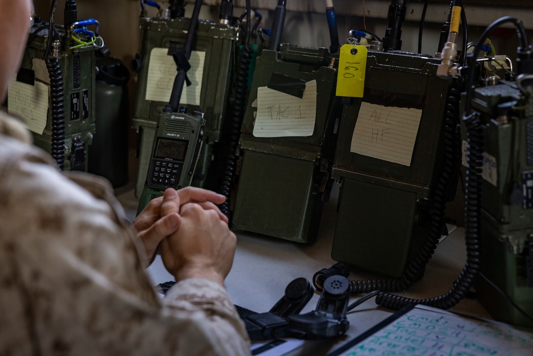 U.S. Marine Corps 2nd Lt. Matthew Smith, a Corpus Christi, Texas native, student with Marine Corps Communication-Electronics School, Training and Education Command, waits for calls on a radio during Basic Communications Officer Course 1-24, at range 225, Marine Corps Air-Ground Combat Center, Twentynine Palms, California, May 1, 2024. During the BCOC students learn about signal modulation, basic electrical concepts, and how to build field expedient antennas. (U.S. Marine Corps photo by Cpl. Hunter Wagner)