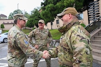 U.S. Space Force Chief of Space Operations Gen. Chance Saltzman, left, is welcomed to the 7th Air Force headquarters at Osan Air Base, Republic of Korea, by U.S. Space Force Lt. Col. Joshua McCullion, U.S. Space Forces – Korea commander, right, and U.S. Air Force Col. Brady Vaira, 7th AF chief of staff, center, May 6, 2024.