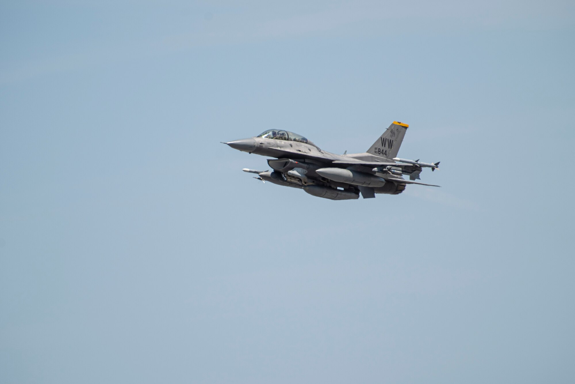 An F-16 fighter jet flies through the air