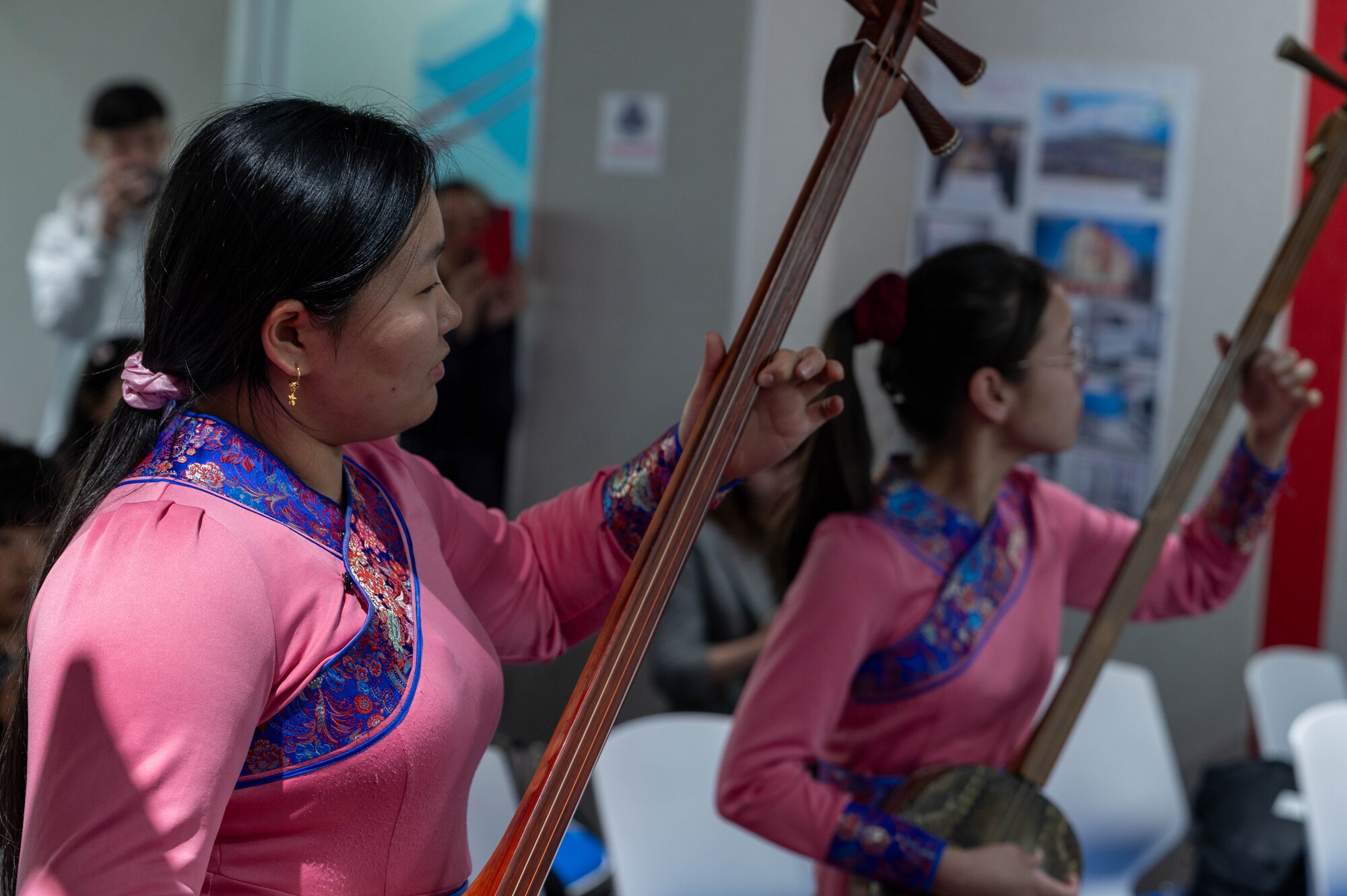 Students play instruments.