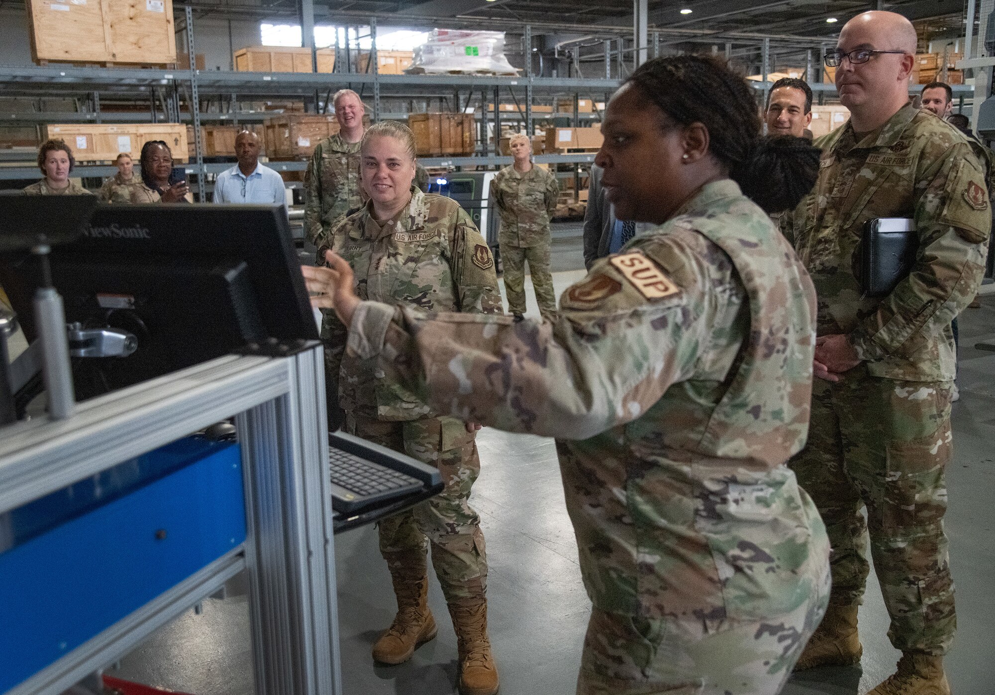 U.S. Air Force Lt. Gen. Linda S. Hurry, Deputy Commander, Air Force Materiel Command, observes a demonstration of the 96th Logistics Readiness Squadron materiel management flight’s new inventory software at Eglin Air Force Base, Fla.