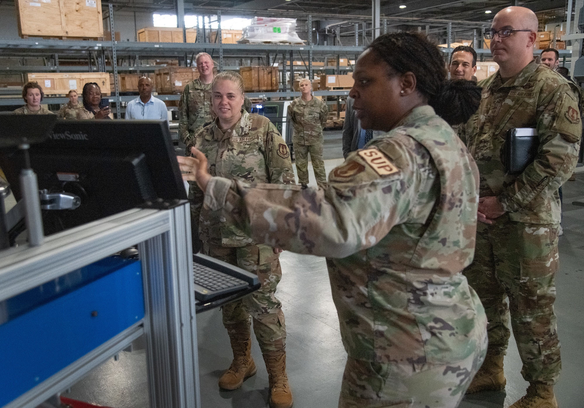 U.S. Air Force Lt. Gen. Linda S. Hurry, Deputy Commander, Air Force Materiel Command, observes a demonstration of the 96th Logistics Readiness Squadron materiel management flight’s new inventory software at Eglin Air Force Base, Fla.