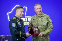 Brig. Gen. B. Uuganbayar, left, deputy director of the Mongolian National Emergency Management Agency, presents a commemorative anniversary plaque to Australian Maj. Gen. Scott Winter, deputy commanding general - strategy and plans for the U.S. Army Pacific, during the Gobi Wolf 2024 opening ceremony at the Governor’s Palace in Choibalsan, Mongolia, May 7, 2024. Gobi Wolf is an annual joint exercise coordinated by the Mongolian National Emergency Management Agency and U.S. Army Pacific that focuses on interagency coordination within Mongolia, as well as foreign humanitarian assistance during a large-scale natural disaster.