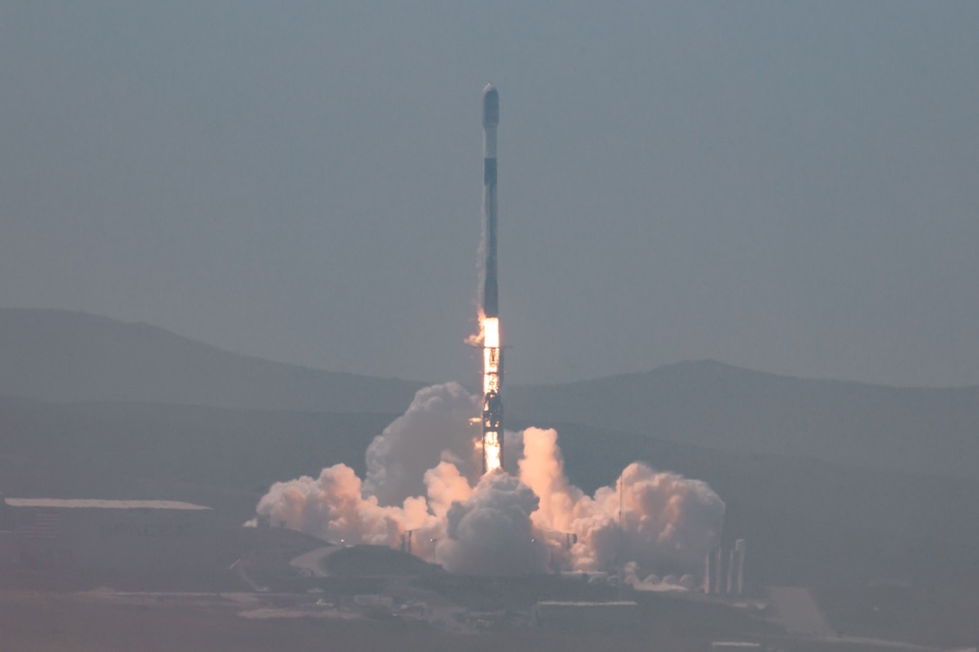 A rocket launches from a launch pad.