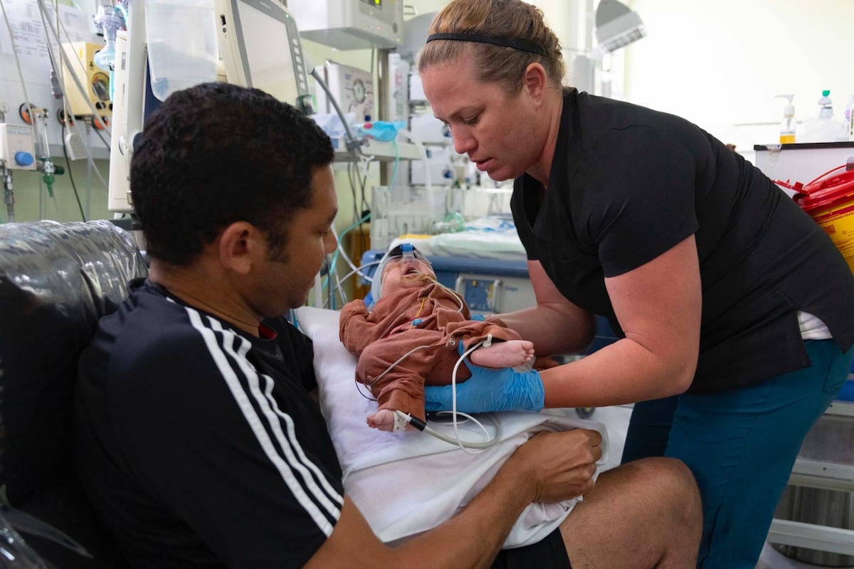 Image of a person treating a patient.