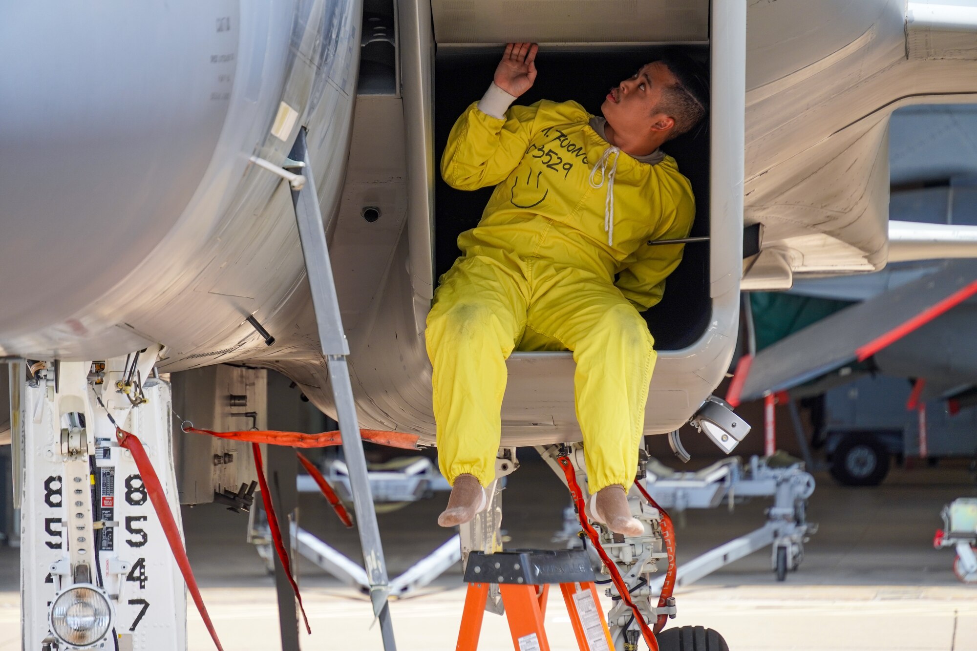 An Airman checks a jet