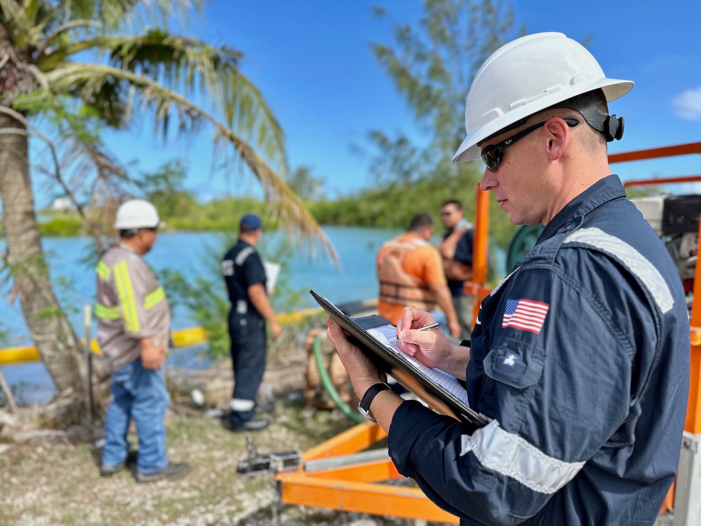 U.S. Coast Guard Forces Micronesia/Sector Guam personnel execute a Government-Initiated Unannounced Exercise (GIUE) at the Harbor of Refuge on Guam testing Supreme Petroleum, a key player in Guam's petroleum industry, and their contracted responder OSROCO, on May 1, 2024. The drill, run and evaluated by personnel from the Guam-based U.S. Coast Guard Emergency Management and Force Readiness, Prevention, and Incident Management divisions, simulated an oil spill scenario to guarantee safety, appropriate notifications, and prompt response actions. The primary mission was to evaluate the facility's ability to execute response plans swiftly and efficiently under real-world conditions, which they met satisfactorily. (U.S. Coast Guard photo by Chief Warrant Officer Sara Muir)