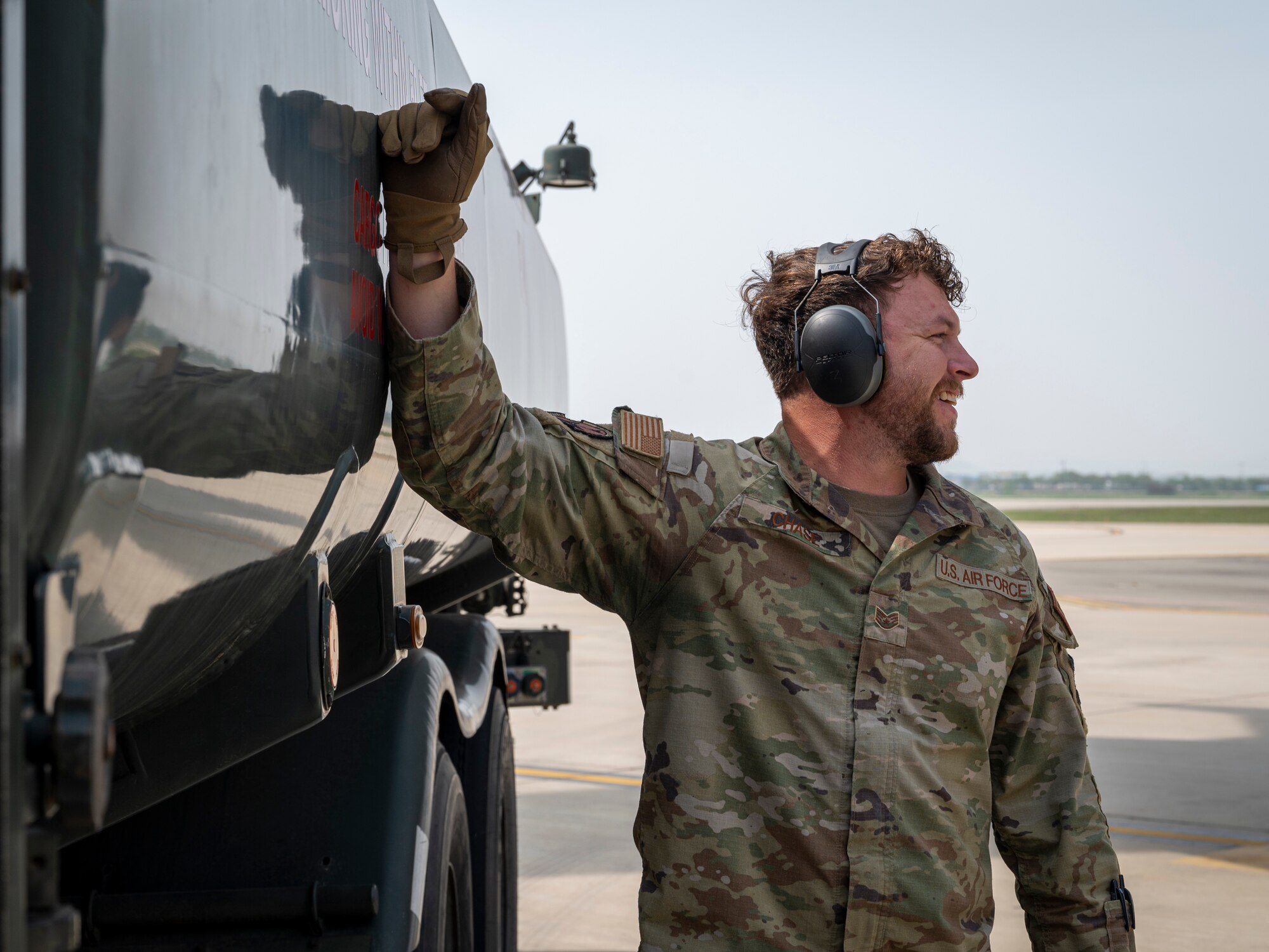 U.S. Air Force Staff Sgt. Chandler Chase, 51st Logistics Readiness Squadron training supervisor, observes defuel operations at Osan Air Base, Republic of Korea, April 19, 2024. The 51st LRS conducted the first-ever wet-wing defuel operation at Osan AB. The operation removes fuel from an aircraft while its engines are running, ensuring aircraft are able to quickly get back into the air. (U.S. Air Force photo by Senior Airman Sabrina Fuller-Judd)