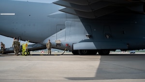 The 51st Logistics Readiness Squadron fuels management flight and Airmen assigned to Joint Base Lewis-McChord conduct a wet-wing defuel operation with a U.S. Air Force C-17 Globemaster III at Osan Air Base, Republic of Korea, April 19, 2024. The 51st LRS completed the inaugural wet-wing defuel at Osan AB. The capability provides fuel for any aircraft from any location, allowing the 51st Fighter Wing to remain ready to ‘Fight Tonight’. (U.S. Air Force photo by Senior Airman Sabrina Fuller-Judd)