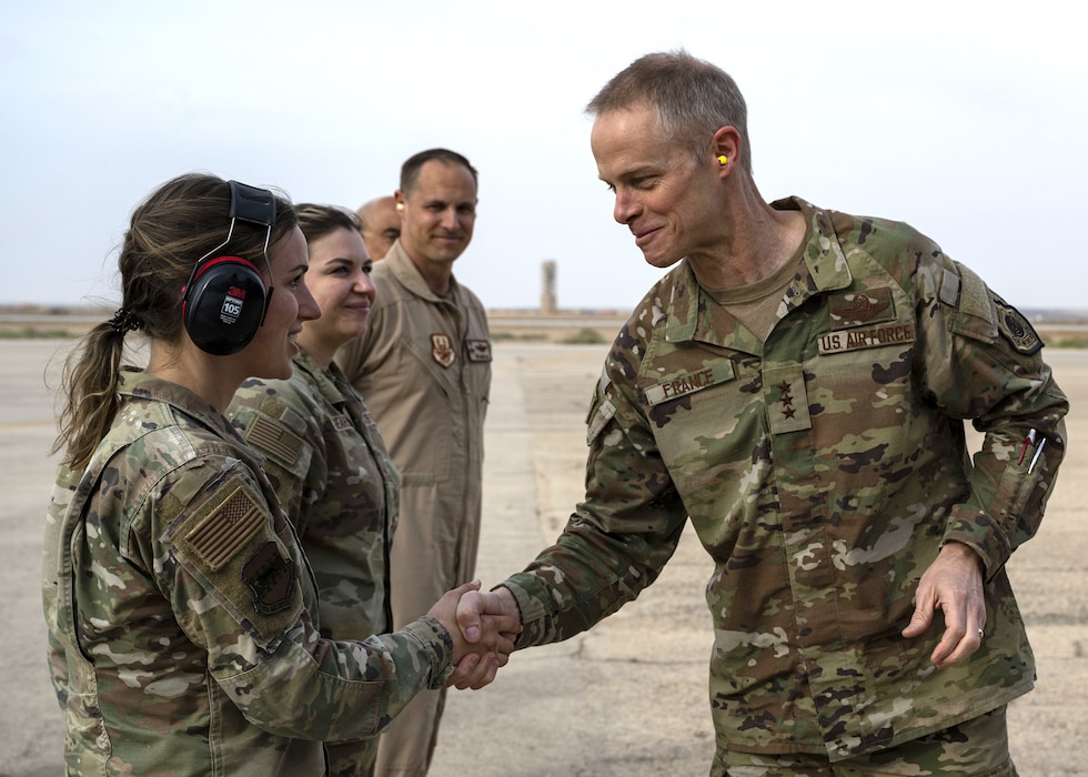 Lt. Gen. France shakes Airman's hand