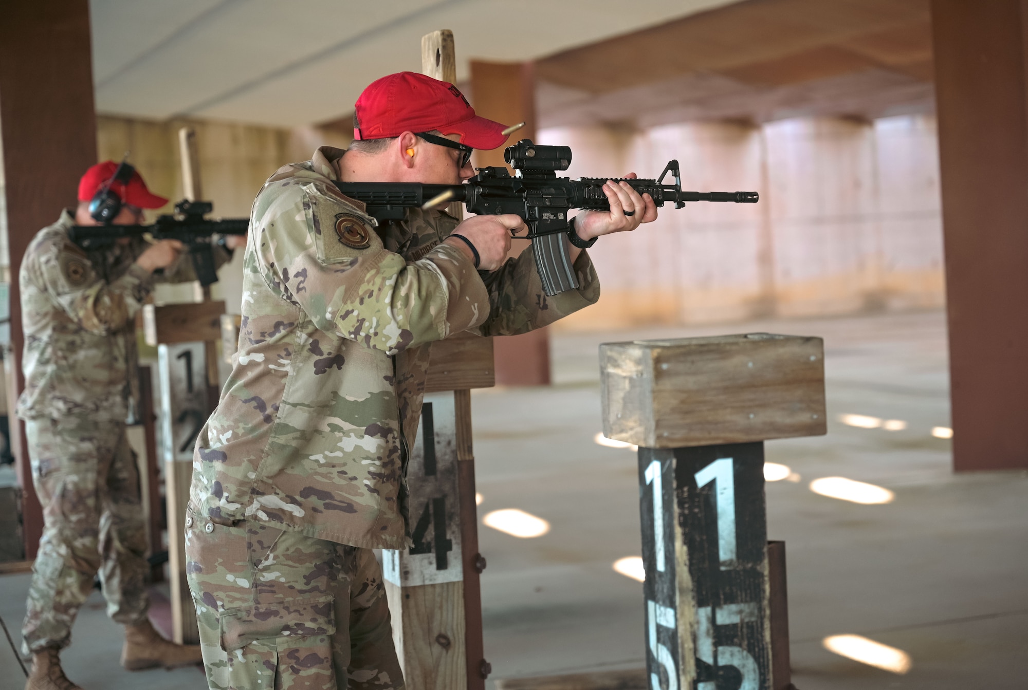 Airman shooting an M-4 Carbine.