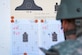 A U.S. Air Force Airman reviews his target after firing practice rounds during a Combat Arms Training and Maintenance course at Joint Base Langley-Eustis, Virginia, May 1, 2024. Service members who are proficient in combat arms training and maintenance are less likely to mistakenly engage friendly forces due to poor visibility or misidentification. (U.S. Air Force photo by Airman 1st Class Adisen Smith)