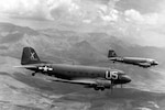 Two C-47A Skytrain aircraft loaded with paratroopers are on their way to southern France to participate in Operation Dragoon, Aug. 15, 1944.
