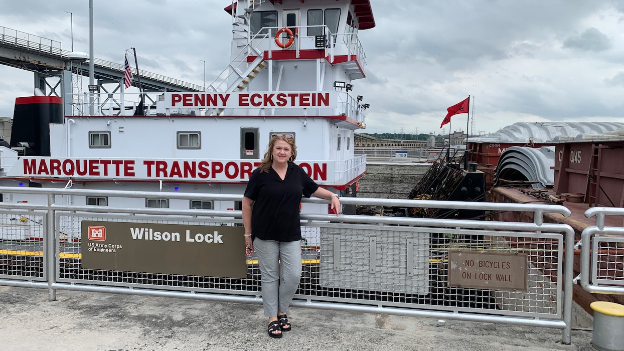 Virginia Bevis, administrative support assistant for the U.S. Army Corps of Engineers Nashville District in the Mid-Tennessee River Area Office, serves employees at Wilson, Wheeler, and Guntersville Locks in Alabama. She is seen here May 7, 2024, by the lock chamber at Wilson Lock on the Tennessee River in Florence, Alabama. (USACE Photo by Donna Robertson)