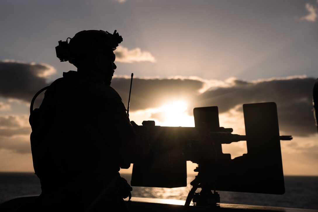 A U.S. Marine with Battalion Landing Team 1/8, 24th Marine Expeditionary Unit (MEU), prepares to shoot an M2 machine gun aboard the San Antonio-class amphibious transport dock ship USS New York (LPD 21) during Composite Unit Training Exercise (COMPTUEX) while underway in the Atlantic Ocean, April 29, 2024. The Wasp (WSP) Amphibious Ready Group (ARG) – 24th MEU is conducting COMPTUEX, their final at-sea certification exercise under the evaluation of Carrier Strike Group 4 and Expeditionary Operations Group. Throughout COMPTUEX, THE WSP ARG-24th MEU is evaluated across a spectrum of scenarios that determine their readiness to deploy. (U.S. Marine Corps photo by Lance Cpl. Ryan Ramsammy)
