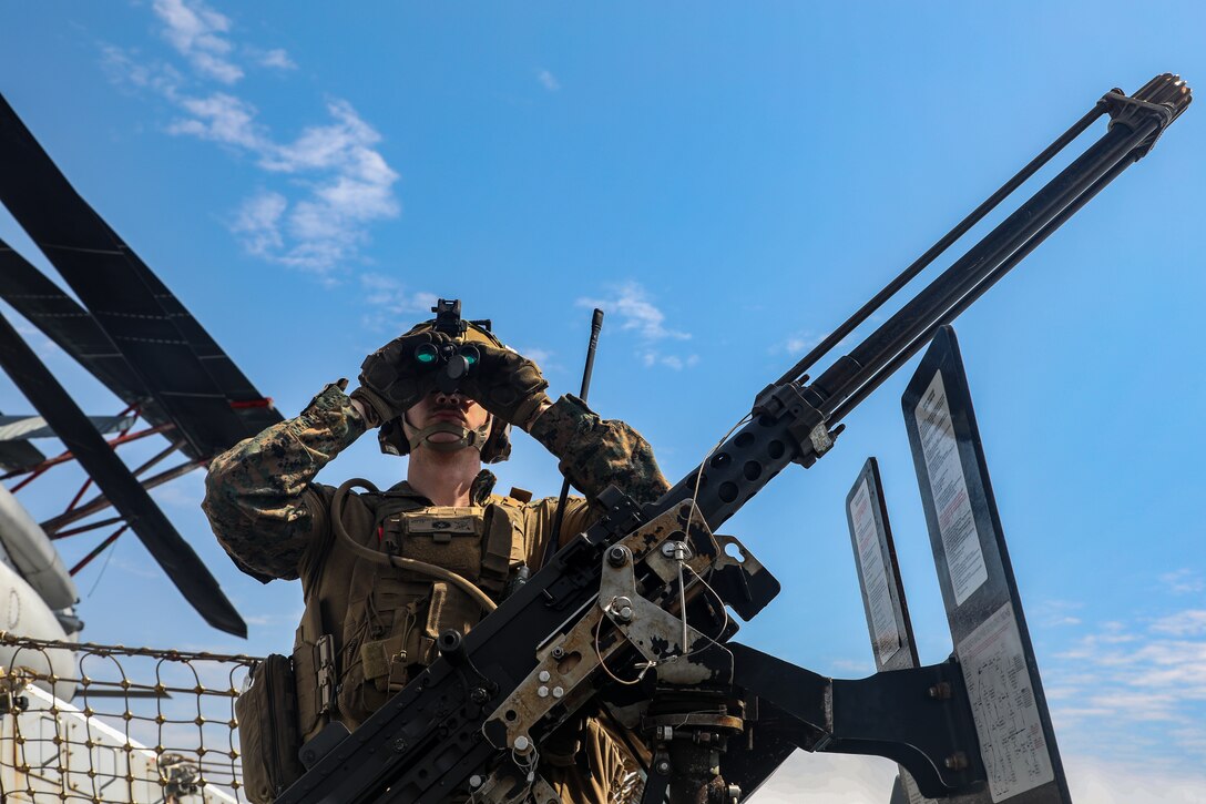 A U.S. Marine with Charlie Company, Battalion Landing Team 1/8, 24th Marine Expeditionary Unit (MEU), participates in defense of amphibious task force training aboard the San Antonio-class amphibious transport dock ship USS New York (LPD 21) while the Wasp (WSP) Amphibious Ready Group (ARG) conducts a simulated strait transit during Composite Training Unit Exercise (COMPTUEX) in the Atlantic Ocean, April 26, 2024. The WSP ARG-24th MEU is conducting COMPTUEX, their final at-sea certification exercise under the evaluation of Carrier Strike Group 4 and Expeditionary Operations Training Group. Throughout COMPTUEX, the WSP ARG-24th MEU is evaluated across a spectrum of scenarios that determine their readiness to deploy. (U.S. Marine Corps photo by Sgt. Jacqueline Peguero-Montes)