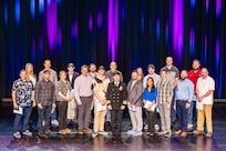 Capt. JD Crinklaw, commander, Puget Sound Naval Shipyard & Intermediate Maintenance Facility, joins some of the 2023 PSNS & IMF employees of the year. PSNS & IMF Employee of the Year nominees, their co-workers, friends and family gathered together at the Admiral Theatre in downtown Bremerton, Washington, April 23, 2024, to honor the command’s top employees during PSNS & IMF’s annual recognition ceremony.
