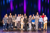 Capt. JD Crinklaw, commander, Puget Sound Naval Shipyard & Intermediate Maintenance Facility, joins some of the 2023 PSNS & IMF employees of the year. PSNS & IMF Employee of the Year nominees, their co-workers, friends and family gathered together at the Admiral Theatre in downtown Bremerton, Washington, April 23, 2024, to honor the command’s top employees during PSNS & IMF’s annual recognition ceremony.