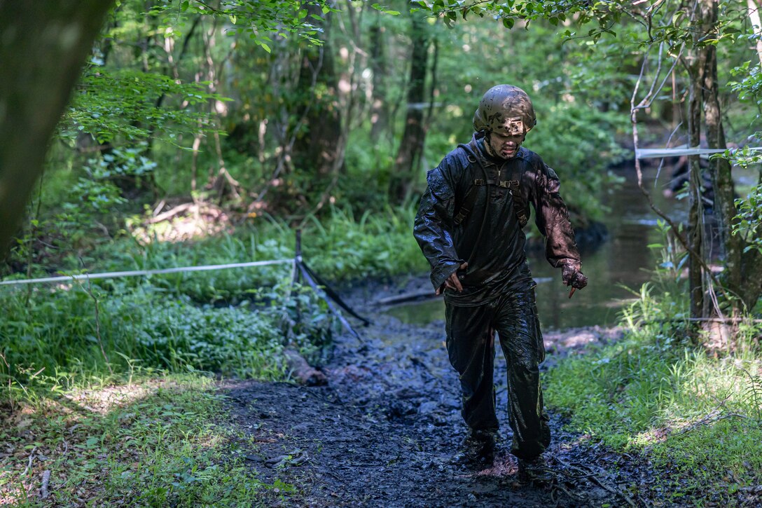 A U.S. Marine navigates past obstacles and various terrain features during an endurance course on Camp Lejeune, North Carolina May 3, 2024. U.S. Marines and Sailors competed and participated in events to promote safety during the summer months, as well as strengthen unit cohesion, promote overall fitness and esprit de corps among all Major subordinate Commands of II MEFF. (U.S. Marine Corps photos by Lance Cpl. Christian Salazar)
