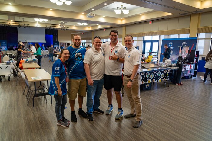 U.S. Air Force 1st Lt. Sarah Goodrich, Staff Sgt. Austin Ellsworth, Capt. Justin Coulter, Staff Sgt. Andrew Tello and Tech. Sgt. Tyler Kelly, Keesler's Air Force Gaming Base Ambassadors, pose for a group photo during Keesler Con and the Eastern Regional Esports Invitational at Keesler Air Force Base, Mississippi, May 4, 2024.