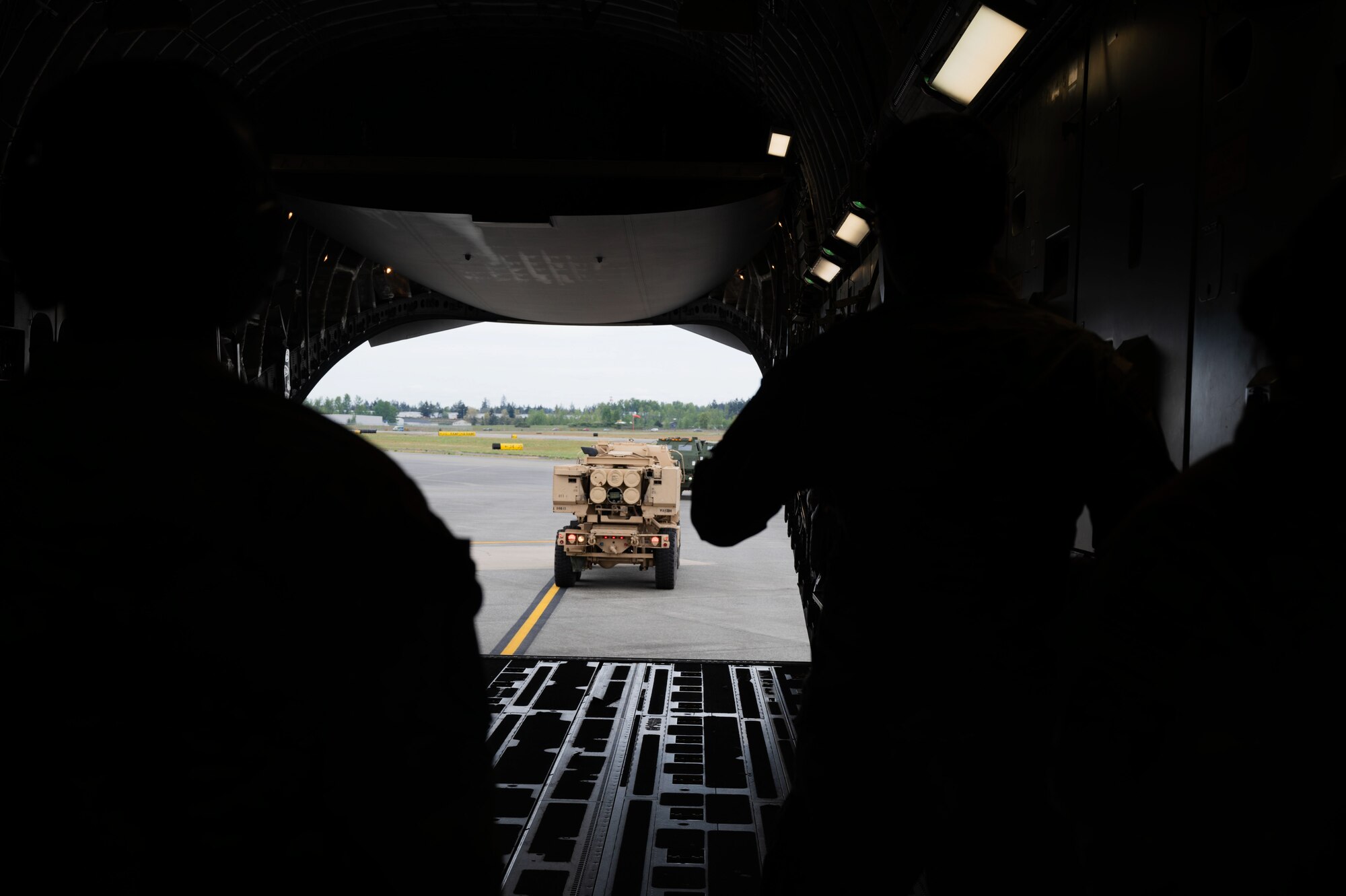 In a collaborative effort, the 62d Airlift Wing partnered with the U.S. Army’s 1st Battalion, 14th Field Artillery Regiment, 75th Field Artillery Brigade, to load multiple High Mobility Multipurpose Wheeled Vehicles (Humvees) and High Mobility Artillery Rocket Systems (HIMARS) into a U.S. Air Force C-17 Globemaster III at Joint Base Lewis-McChord, Washington, May 3, 2024. This joint effort is in support of Exercise Swift Response 24, which is a U.S. Army Europe & Africa led exercise focused on Allied airborne forces’ ability to respond to crises quickly and effectively as an interoperable, multi-national team. The airborne operations and training with Allies and partners showcase the 62d AW’s ability to execute today’s global airlift mission across the globe.