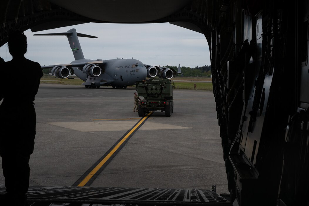 In a collaborative effort, the 62d Airlift Wing partnered with the U.S. Army’s 1st Battalion, 14th Field Artillery Regiment, 75th Field Artillery Brigade, to load multiple High Mobility Multipurpose Wheeled Vehicles (Humvees) and High Mobility Artillery Rocket Systems (HIMARS) into a U.S. Air Force C-17 Globemaster III at Joint Base Lewis-McChord, Washington, May 3, 2024. This joint effort is in support of Exercise Swift Response 24, which is a U.S. Army Europe & Africa led exercise focused on Allied airborne forces’ ability to respond to crises quickly and effectively as an interoperable, multi-national team. The airborne operations and training with Allies and partners showcase the 62d AW’s ability to execute today’s global airlift mission across the globe.