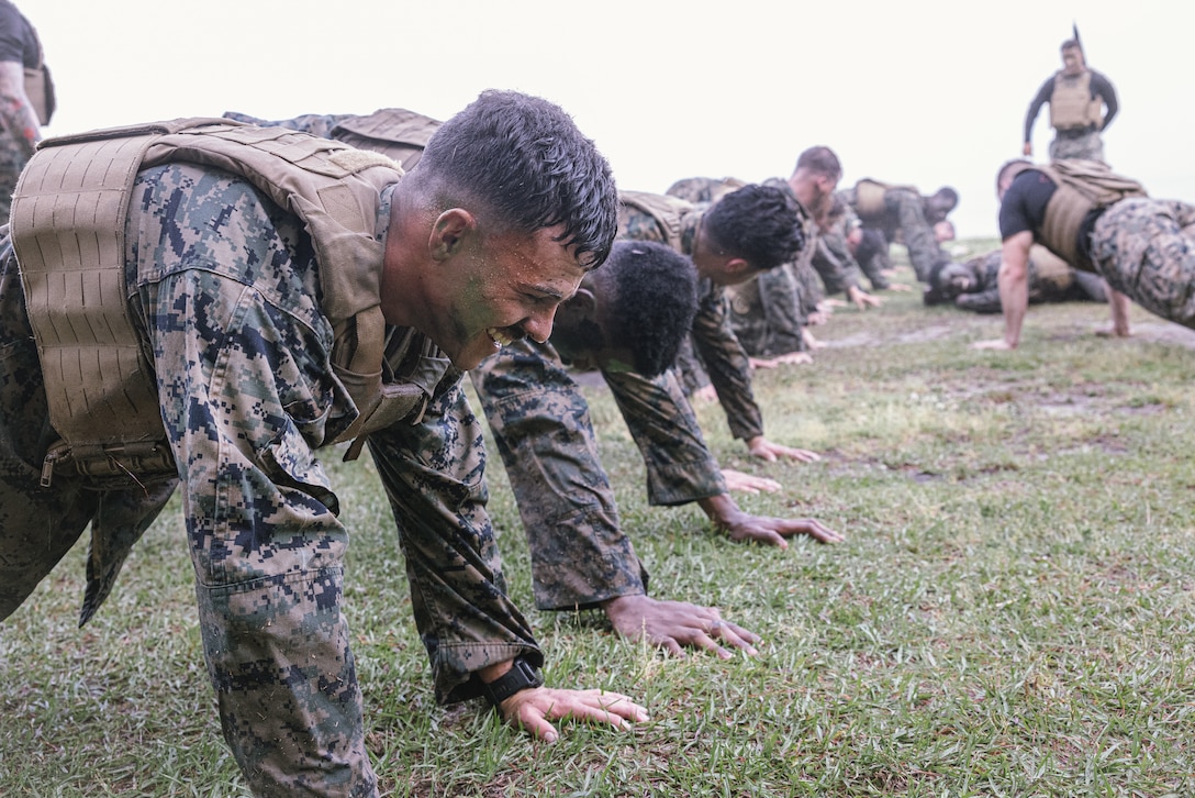 U.S. Marines low crawl during the culmination of Martial Arts Instructor Course (MAIC) 72-24 on Marine Corps Base Camp Lejeune, North Carolina, May 2, 2024. After three weeks of academic classes, advanced martial arts training and pushing their mental grit and physical toughness, Marines graduating MAIC 72-24 earned their ability to lead others in the Marine Corps Martial Arts Program. (U.S. Marine Corps photo by Lance Cpl. Loriann Dauscher)