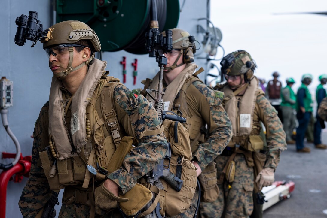 U.S. Marines with Alpha Company, Battalion Landing Team 1/8, 24th Marine Expeditionary Unit (MEU), embark the amphibious assault ship USS Wasp (LHD 1) in the Atlantic Ocean after conducting a simulated night raid during Composite Training Unit Exercise (COMPTUEX), April 30, 2024. The WSP ARG-24th MEU is conducting COMPTUEX, their final at-sea certification exercise under the evaluation of Carrier Strike Group 4 and Expeditionary Operations Training Group. Throughout COMPTUEX, the WSP ARG-24th MEU is evaluated across a spectrum of scenarios that determine their readiness to deploy. (U.S. Marine Corps photo by Lance Cpl. John Allen)