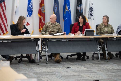 Image of people speaking at table